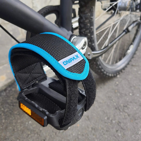 Outdoor Bike Pedal Straps With Adjustable Toe Clips For Fixed Gear BMX And MTB attached to a bicycle pedal