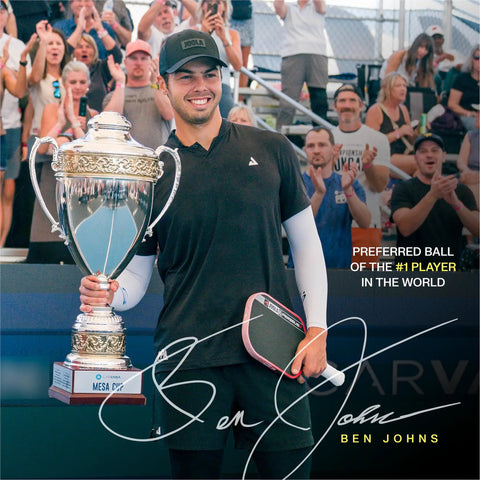 Hardcourt Pickleball Balls with Storage Tube USAP Approved for Tournament Play endorsed by Ben Johns holding trophy