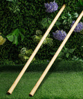 Two Pack Solid Wood Replacement Handles For Round Eye Hoe 54 Inches 137 Cm Grub Hoe Shovel Spading Fork Rake Garden Tool Weeding Natural Finish Heavy Duty Universal Fit For Other Round Eye Tools Durable Backup For Home Gardeners shown against a garden backdrop