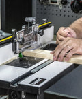 Heavy Duty Portable Benchtop Router Table Featuring A Rock Solid Steel Frame 24 By 16 Inch laminated work surface in use with wood.
