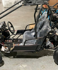Kids 125cc Go Kart Raptor Style Fully Automatic With Reverse Blue Mid Size 4 Stroke Power displayed in garage