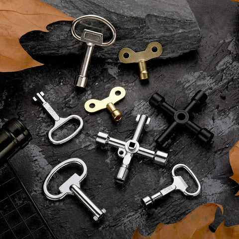 11 Piece Multi Functional Utility Key Kit for Plumbers and Home DIY Projects with 4 Way Keys on black stone surface