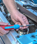Using 13 In 1 Ratcheting Multi Bit Screwdriver With Quick Load Cushion Grip 28 Tooth Ratchet on car engine, close-up