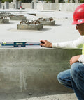 Worker using GIM 60 24 Inch Digital Level with Illuminated Rotating Display on construction site