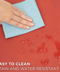 Hand wiping liquid on red Anti Fatigue Standing Desk Floor Mat For Home Office Kitchen Garage 18x22 Inch Rubberized Gel Foam.
