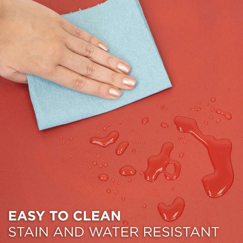 Hand wiping liquid on red Anti Fatigue Standing Desk Floor Mat For Home Office Kitchen Garage 18x22 Inch Rubberized Gel Foam.