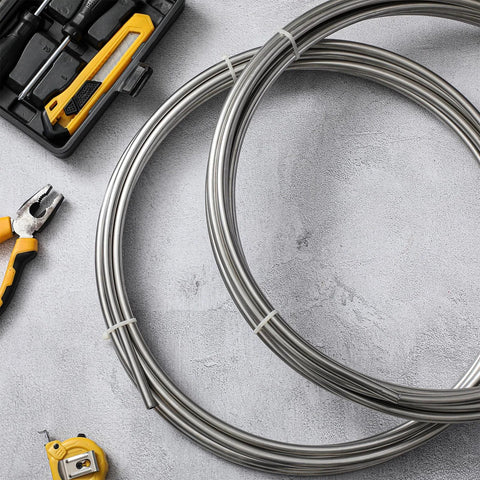 MorningRo 1/4 in x 50 ft 304 stainless steel tubing coil, two coils visible in workshop setting