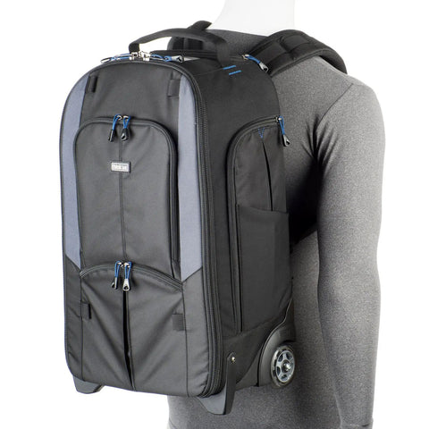 Streetwalker Rolling Camera Backpack With Dedicated Laptop Pocket And Minimalist Black Exterior, Hidden Zip Opening For Main Compartment When Not In Use, Durable, Travel Ready For Photographers On The Go, displayed on a mannequin