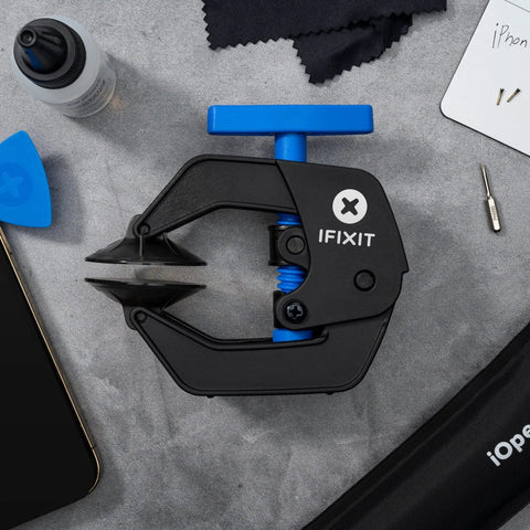 Pro Grade Anti Clamp Opening Tool For Phones And Tablets With Dual Suction Cups And Adjustable Opening Force For Safe Adhesive Removal And Gentle Glass Screen Separation No Fuss displayed on a surface with tools