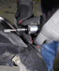 One Quarter Inch Air Die Grinder With Straight Head Design being used for grinding on a vehicle part
