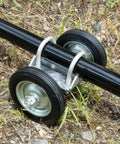 Beefed Up Heavy Duty Gate Wheel Carrier For Driveways And Fences, 6 Inch Rolling Wheel Caster, shown on grass supporting gate frame