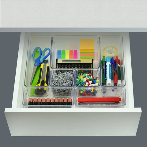 7 Piece Drawer Organizer Set With 4 Different Sizes Clear Crystal Plastic Trays in a desk drawer with office supplies