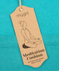 Zafu Yoga Meditation Cushion With Washable Cover And Buckwheat Filling Soft Round Cotton Floor Pillow For Meditation Pranayama And Stress Relief Turquoise Color Cozy Ergonomic Vibe For Home Studio Or Yoga Room. Tag on turquoise fabric.