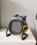Electric Forced Air Heater With Pivoting Base 5120 BTU In Yellow For Garages And Shops, 1500W PTC Ceramic Heating on table