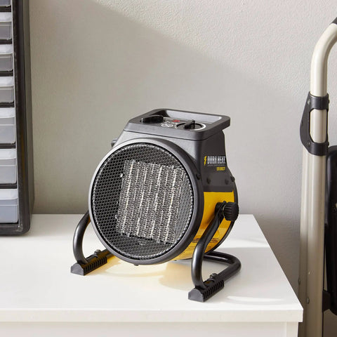 Electric Forced Air Heater With Pivoting Base 5120 BTU In Yellow For Garages And Shops, 1500W PTC Ceramic Heating on table