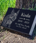 Personalized Pet Memorial Stone With Photo For Dogs And Cats Custom Headstone And Garden Marker With Image For Remembrance Engraved Puppy And Kitten Memorial Plaque For Cremation, displaying an engraved dog on black granite in a garden setting.