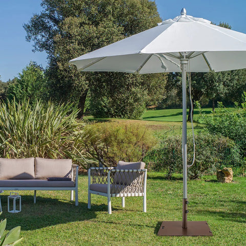 Patio scene with heavy duty 50 lb patio umbrella base, 24 inch square holder, two tightening knobs, wheels, weatherproof steel brown.