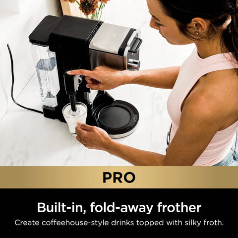 Woman using Hot And Iced Coffee Maker With All In One Dual Brew Pro System For Single Serve Or Drip Brew, 13 Brew Sizes, frothing milk