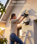 Woman installing Onforu 36W Solar LED Security Lights, PIR Motion Sensor Outdoor, Yard on a wall.