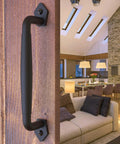 10 Inch Round Rustic Barn Door Handle In Black Steel Versatile Pull For Sliding Doors Gates Garages Sheds Fences Closets And Pantries Indoor And Outdoor Use With Easy Install Durable Black Powder Coated Finish For Weather Resistance And Smooth Operation installed on wood door in living area
