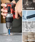 Front view of a red cordless drill fitted with a blue diamond tile drill bit (1/4-inch shank) drilling into a metal surface.