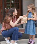 Mother handing child Natural Paper Sandwich Bags With Greaseproof Barrier, 48 Count Pack, Unbleached Eco Friendly Lunch Bags