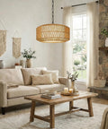 Five Light Hand Woven Rattan Chandelier With Totally Adjustable Drop From Nine To Fifty Two Inches And Soft Linen Shades For Kitchen Island Super Cozy Glow hanging above a cozy living room setting with neutral colors.