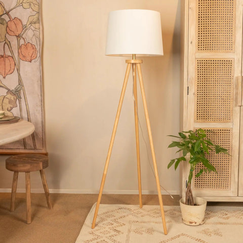 Dope Mid Century Modern Tripod Floor Lamp With Linen Shade In Natural And Cream Rubber Wood Base 63 Inch Tall 7 Foot Cord Rotary Switch Perfect For Living Room Or Bedroom next to a cabinet