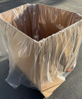 Heavy Duty White Gaylord Box Liners For Industrial Tote Bins Up To 55 By 55 By 75 Inches covering a large cardboard container.