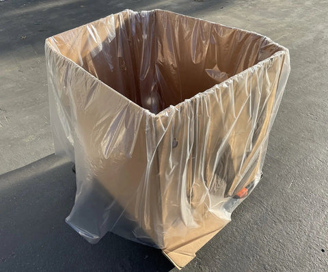 Heavy Duty White Gaylord Box Liners For Industrial Tote Bins Up To 55 By 55 By 75 Inches covering a large cardboard container.