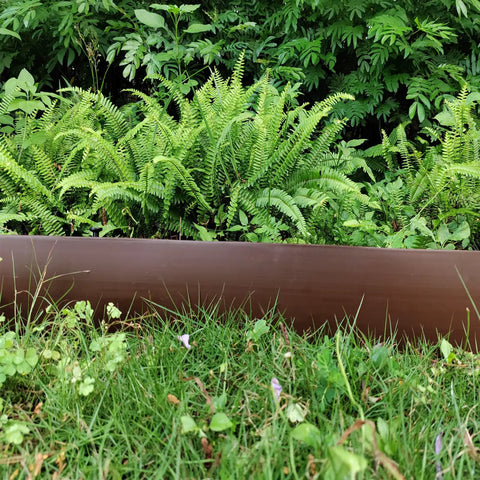 DIY Friendly 20Ft Plastic Garden Edging Kit With 25 Stakes Four Point Five Inch Tall Lawn Border installed in garden