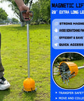 Person using Long Reach Magnetic Pickup Tool With Quick Release 29 Inch Bulk Lifter on grass, collecting nails and screws.