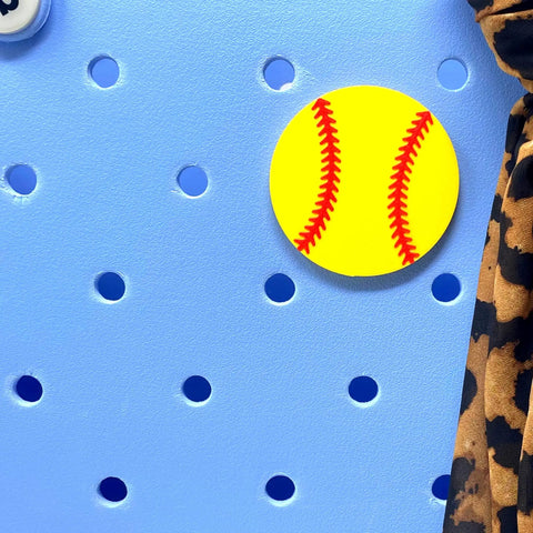 Softball Ball Tote Bag Charm With Team Spirit, bright yellow softball on blue pegboard, decorative accessory detail