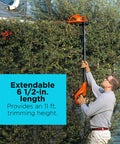 Man using 20V Max Cordless Pole Hedge Trimmer With 18-Inch Dual-Action Blade reaching 11 feet to trim tall hedges.