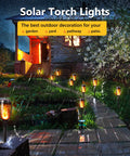 12 Pack Solar Torch Lights With Flickering Flames For Outdoor Use illuminating a garden path and patio at night.
