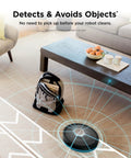 AI Robot Vacuum With XL Self Empty Base Mega Suction For Pet Hair Lidar Navigation Bagless 60 Day Capacity Alexa And WiFi Connected Cleans Carpet And Hard Floors Black navigating around obstacles in a living room.