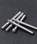 Carbide burr set for metalwork shown in close-up, featuring five solid carbide rotary burr tools with a quarter-inch shank for precision tasks.