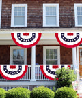 All American Patriotic Bunting Banner Pack With A 4 Pack Of Red White And Blue Half Fan Flags displayed on a porch railing