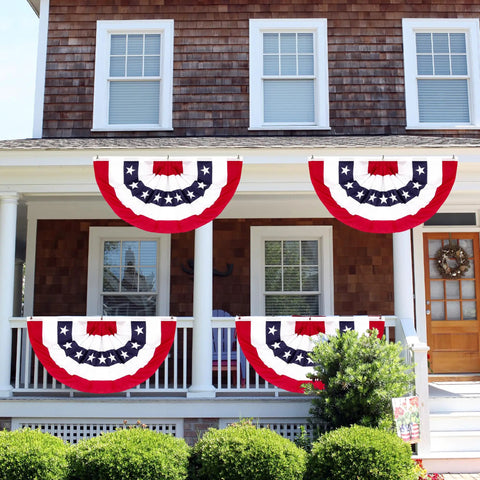 All American Patriotic Bunting Banner Pack With A 4 Pack Of Red White And Blue Half Fan Flags displayed on a porch railing