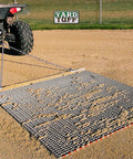 Heavy Duty Zinc And Steel Mesh Field Drag Mat For Surface Leveling with tow chain attached to vehicle on sandy field