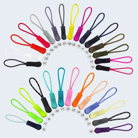 Colorful set of 28 zipper pull replacements, including non-slip rubber grips and durable nylon cords, arranged in a circular pattern.