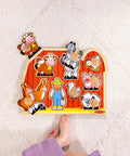 Farm Animals Jumbo Knob Puzzle For Toddlers Wooden Peg Puzzle For Early Learning Shape Recognition And Fine Motor Skills Cow Pig Horse On Colorful Barnyard Scene Kid Friendly Educational Toy For Ages 1 And Up with child's foot.