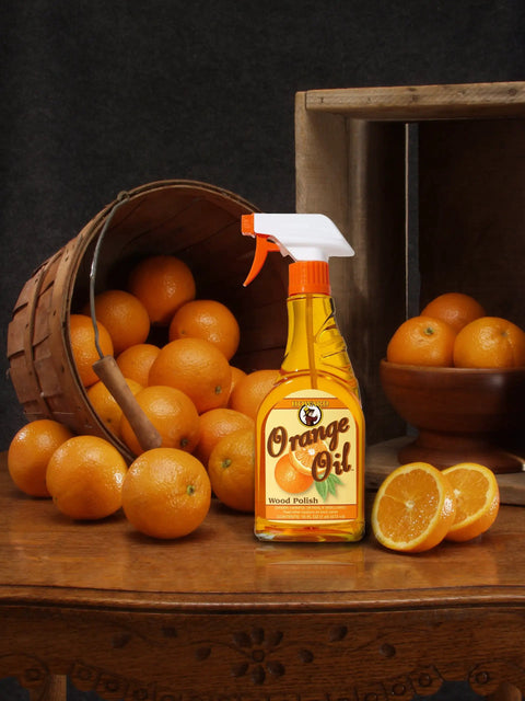 Orange Oil Wood Polish for Antique Furniture and Cabinets, Cleans Dirt and Wax Build-Up, Fresh Orange Scent, 16 oz bottle on table
