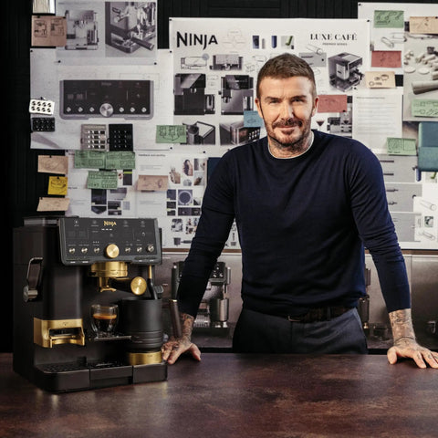 Top Shelf All In One Espresso Machine Featuring Built In Grinder And Hands Free Frother For Crisp Cold Brew And Fresh Drip Coffee Big Time Black Gold Edition with designer David Beckham.