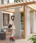 Outdoor space with Beefy Black Curtain Rods For Windows 66 To 120 Inches, rustic pipe style, holding white curtains under a pergola.
