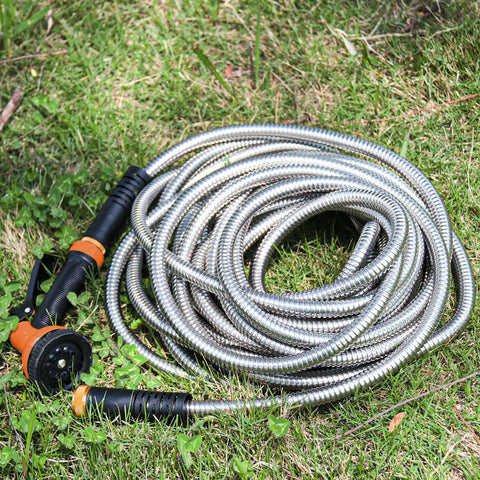 Coiled No Tangle 25ft Stainless Steel Garden Hose With Ten Function Adjustable Spray Nozzle on grass