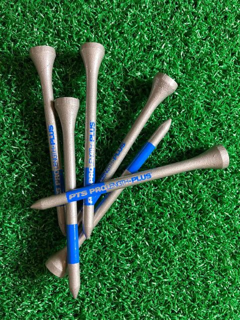 PTS Titanium Strength Wooden Golf Tees 65 Count Two And Three Quarter Inch Pro Grade Tee Set with 8 Percent Thicker Shaft on grass