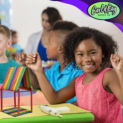 Child enjoying One Stop Arts And Crafts Kit For Kids And Toddlers With A Seriously Huge Supply Of Pipe Cleaners and Popsicle Sticks