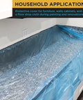 Blue Pre Taped Masking Film 71 Inch By 65 Foot Three Pack Drop Sheet With Built In Tape covering a kitchen countertop