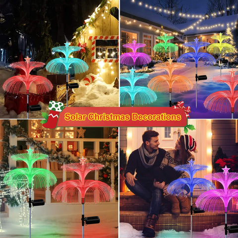 Solar Star Jellyfish Garden Lights Six Pack With Color Changing Fiber Optic Glow illuminating a festive outdoor setting at night.